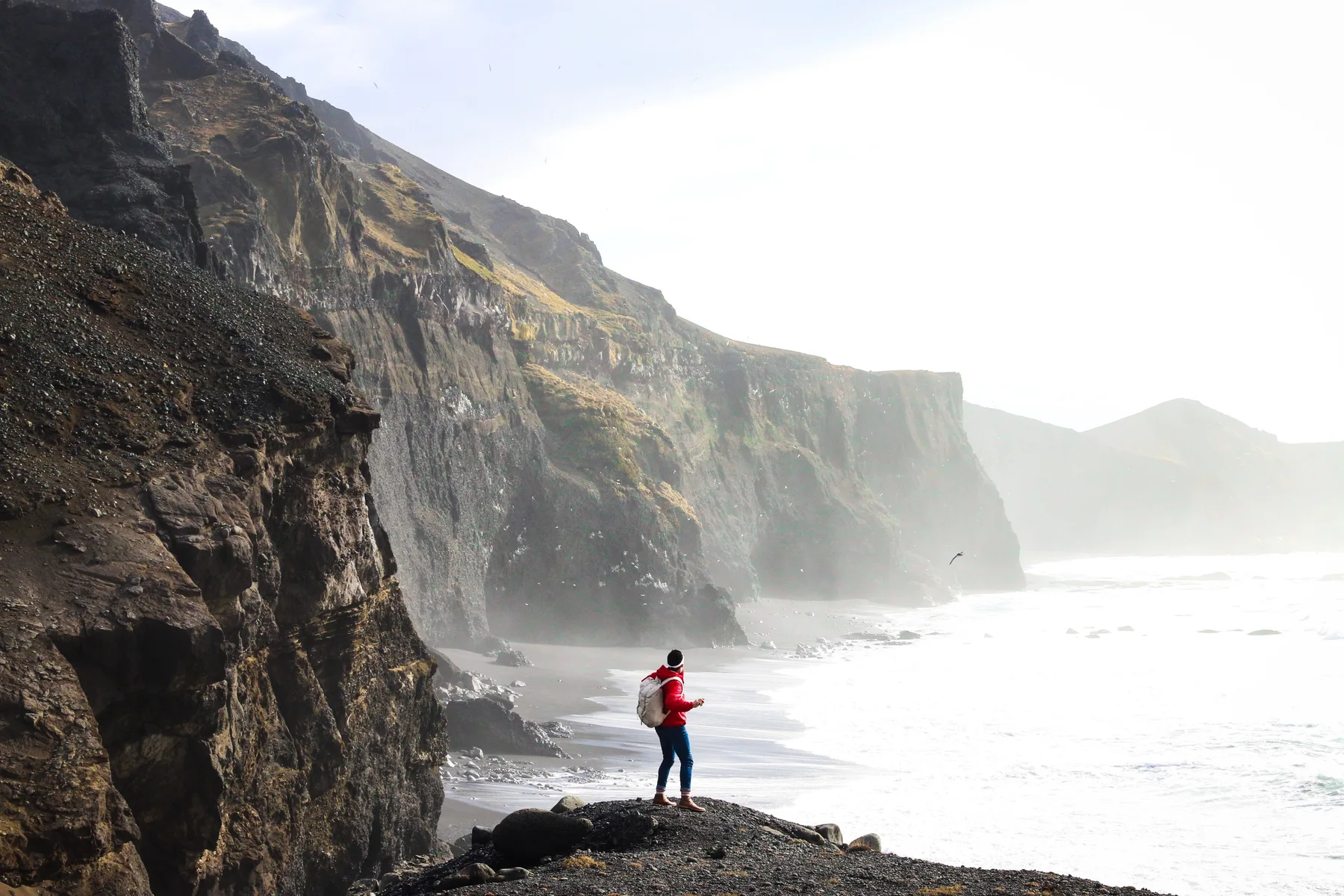 A traveller exploring the Icelandic coast